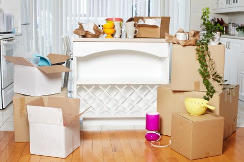 Professional movers unloading boxes at a Clapton property