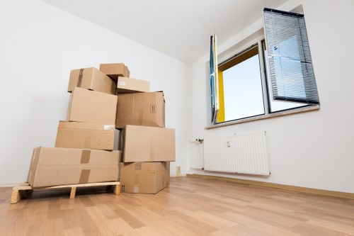 Packed office equipment ready for relocation in a Clapton business move
