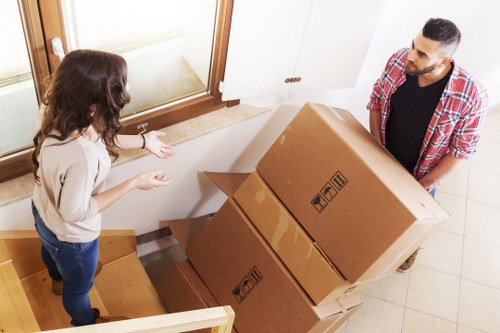 Professional movers handling a flat move in Clapton with stairs
