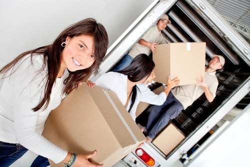 Packed boxes and moving equipment ready for removals in Clapton