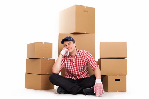 Packed moving boxes and furniture ready for transport in East London